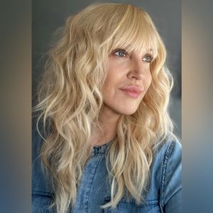 Modern Platinum Peach Blonde Curly Layered Wig with Bangs by Nikita (17)